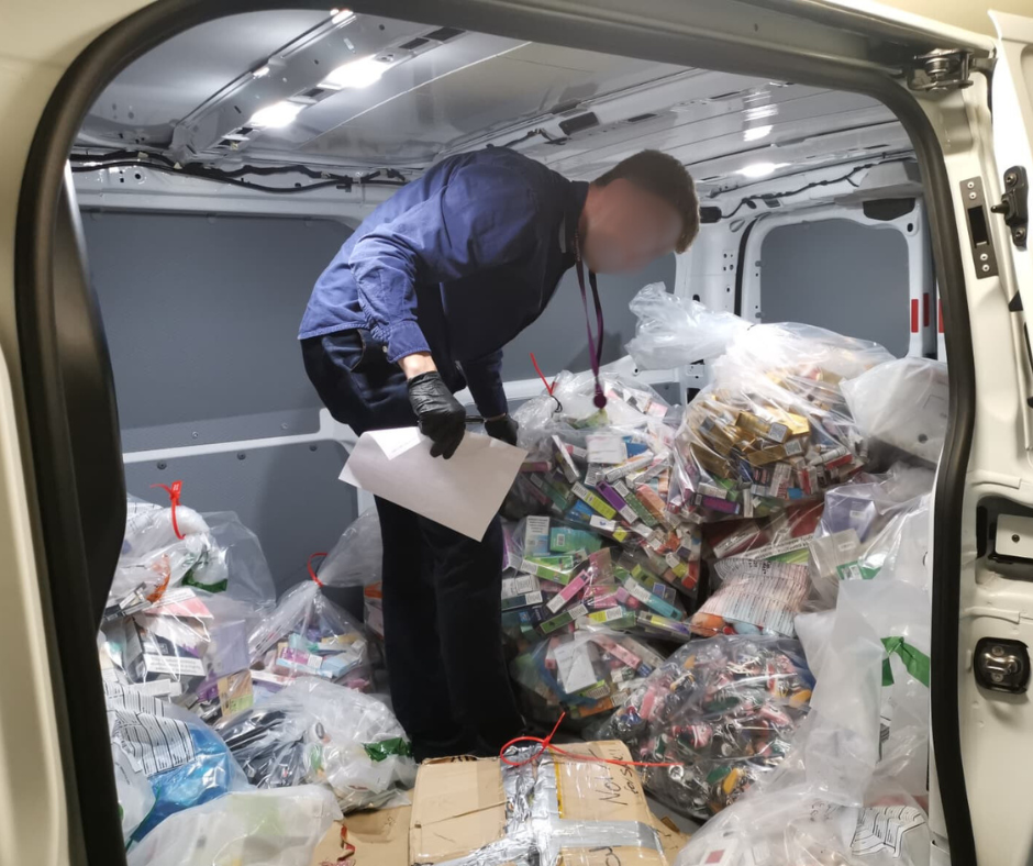 A member of the council s enforcement team records seized tobacco and vape products
