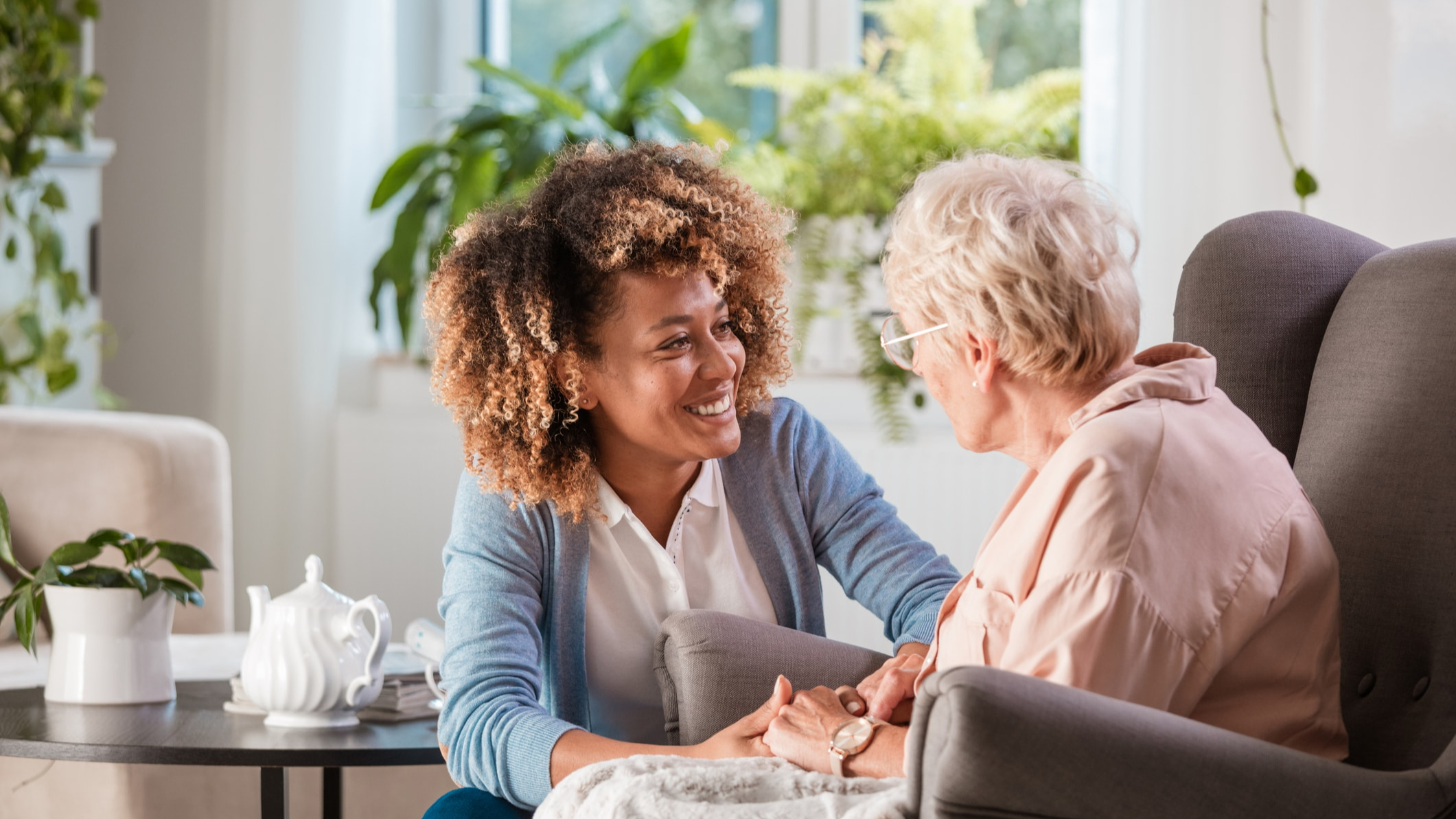Carer and an elderly lady sitting together