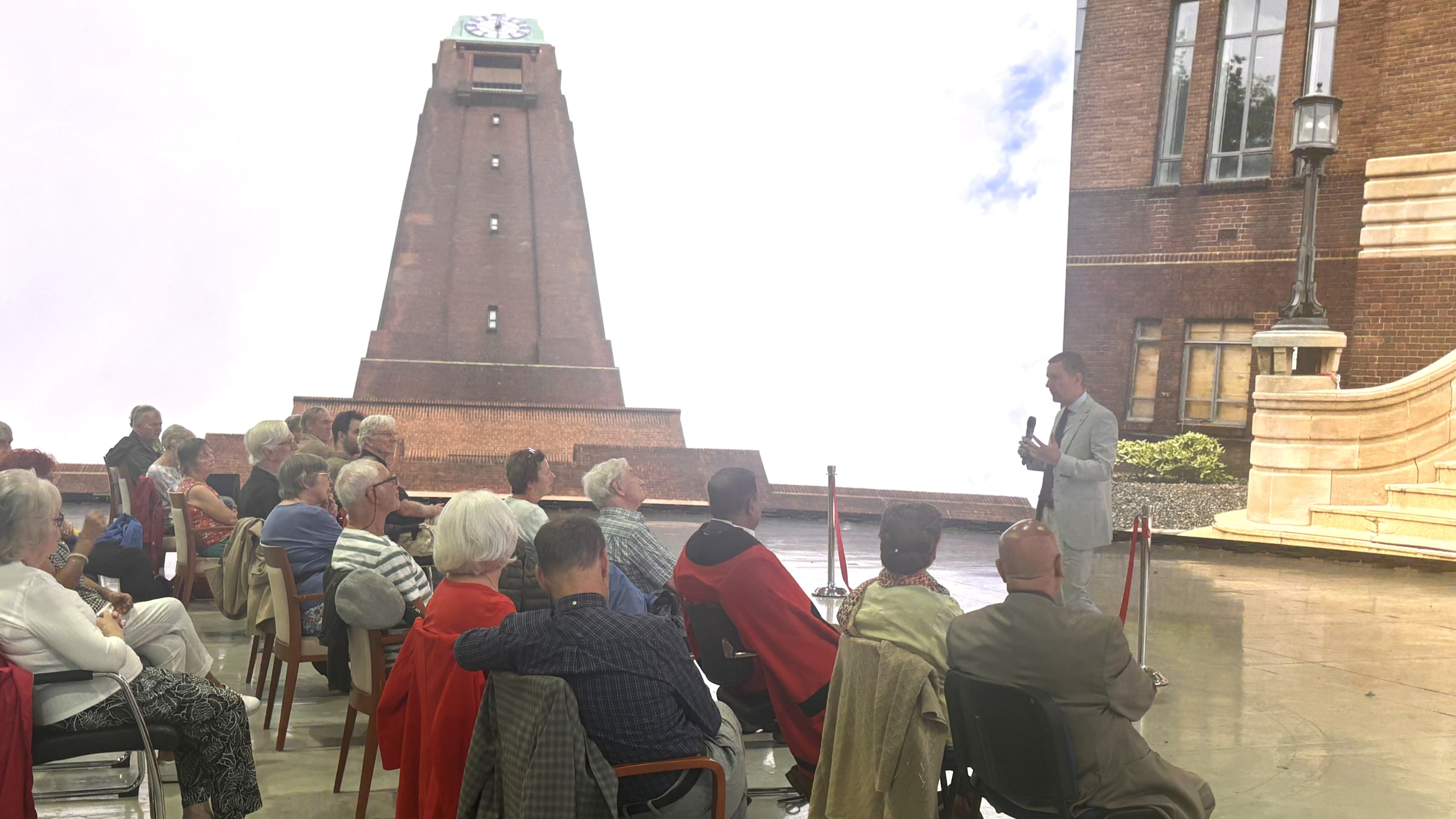 Cllr Bruce addressing people gathered to celebrate the inauguration of the clock tower