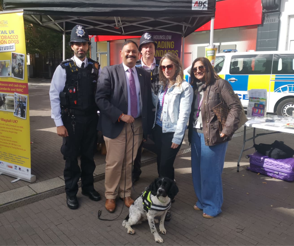 Cllr rajawat with a sniffer dog police officers and members of the enforcement team