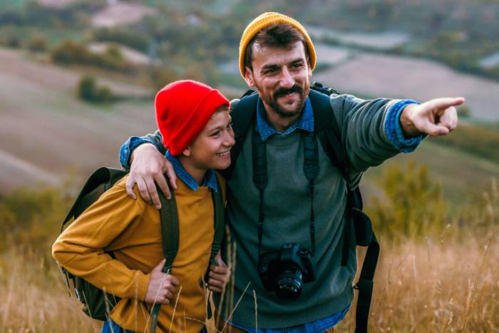 Adult and teenage child enjoying a hike