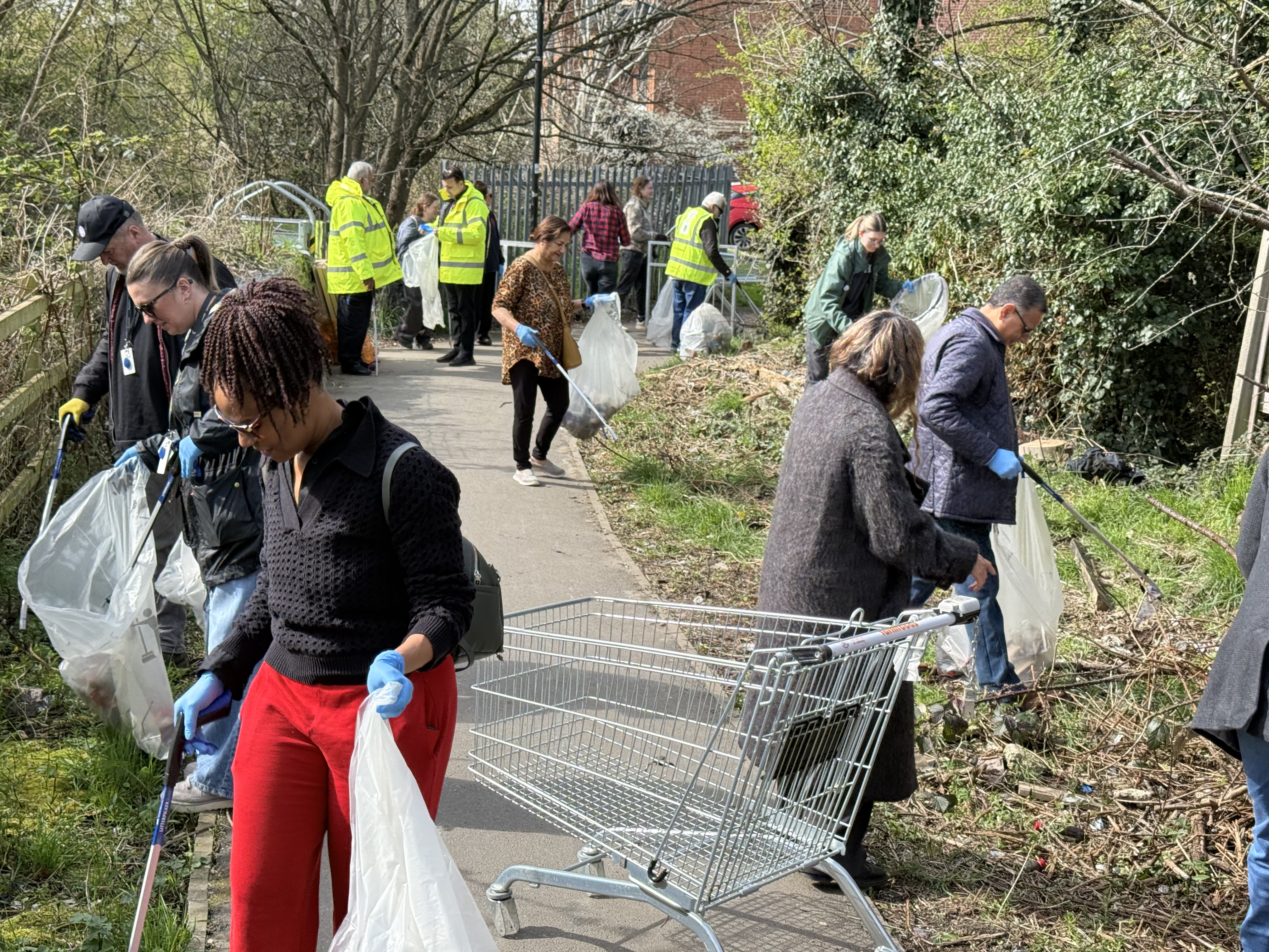 Cllrs and members of the local community actively involved in a litter pick event at Bedfont Pitts