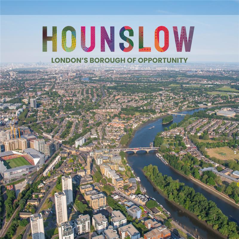 An aerial view of Hounslow with the word 'hounslow' written in multicolours in on the skyline