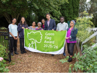 Cllr Shaheen holds green flags award