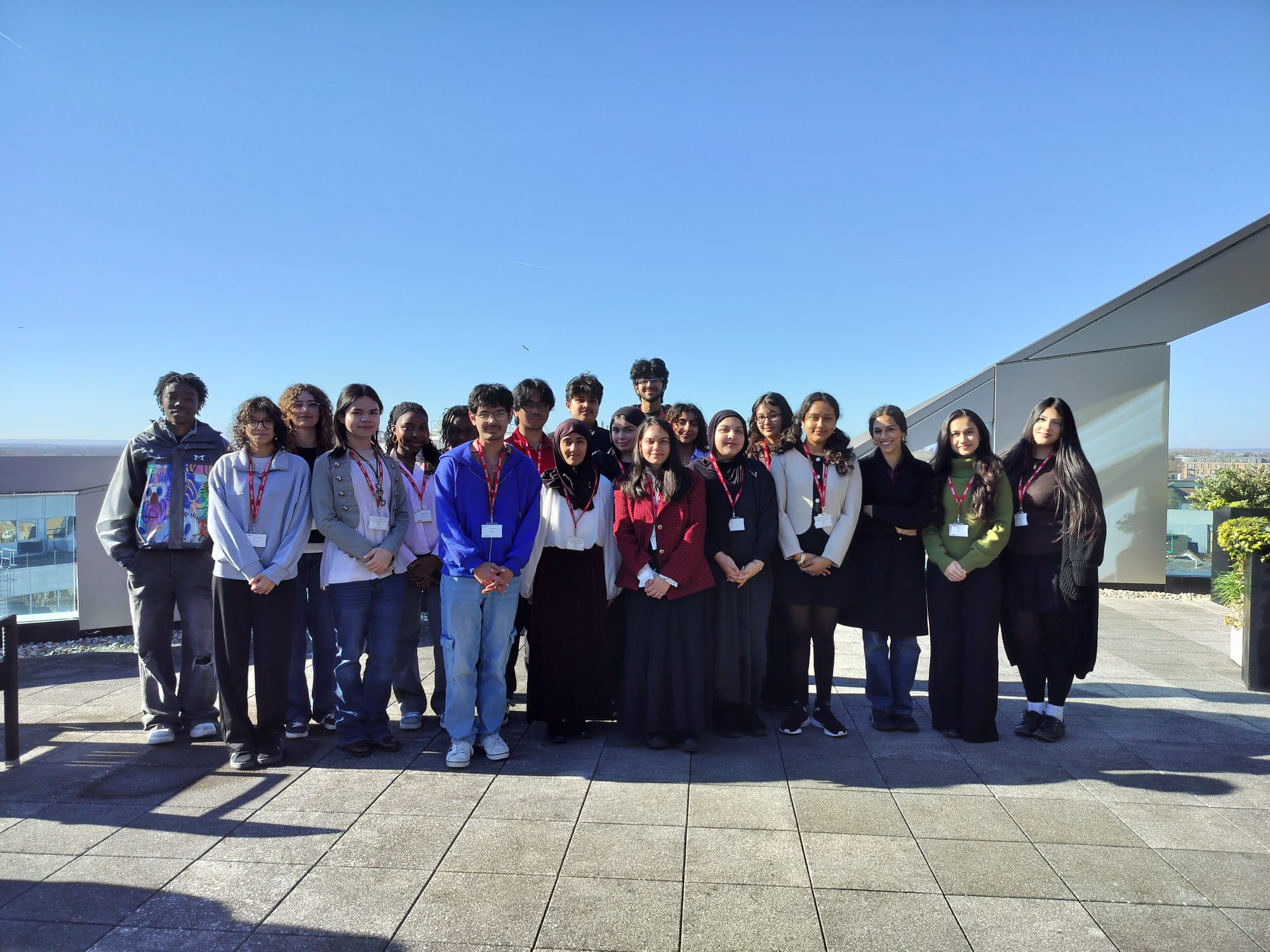 Participants of Youth Takeover Day stand on Hounslow House balcony