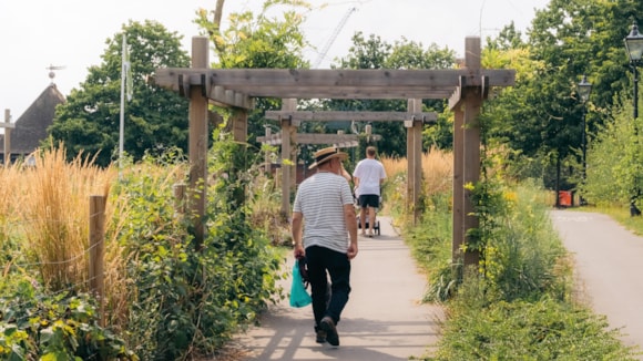 People enjoying a green space in Hounslow