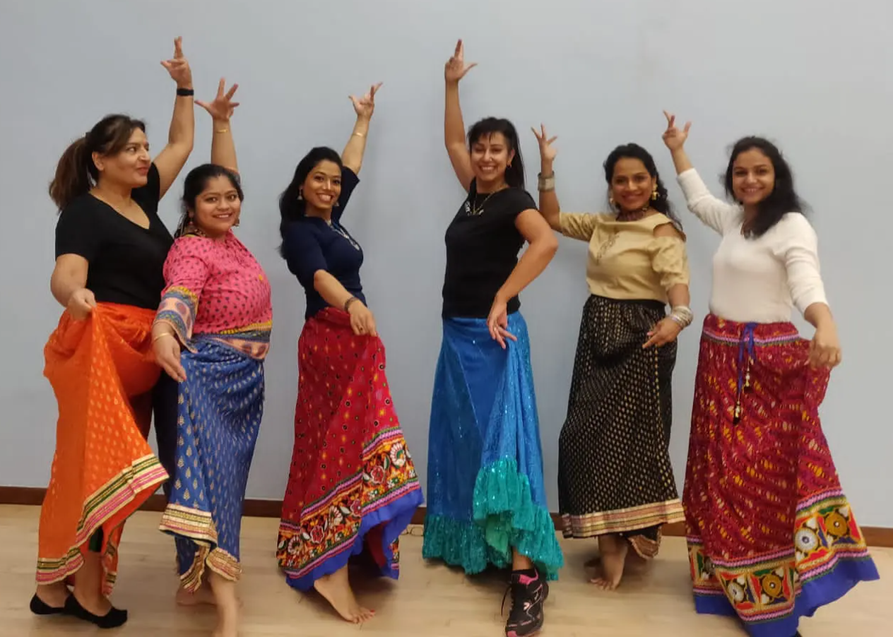 Image of six women part of the Shakti Divas bhangra fusion dance group