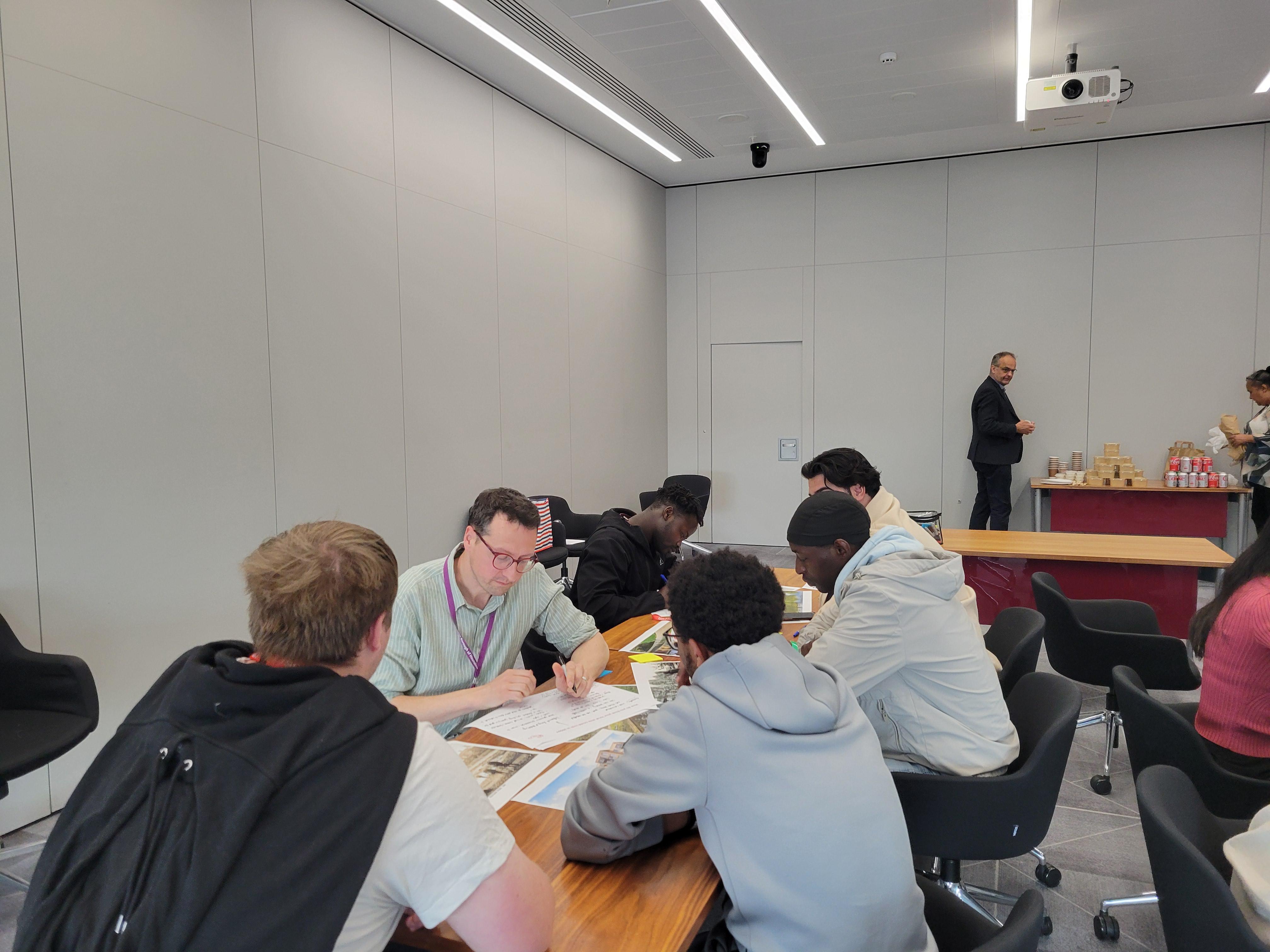 Colleagues sitting around a large table